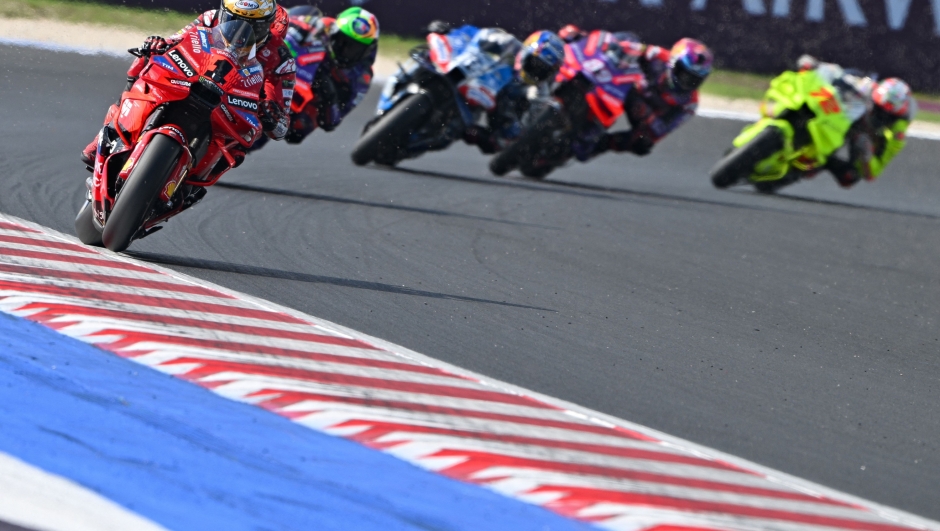 Ducati Lenovo Team's Italian rider Francesco Bagnaia (L) rides during the qualifying session of the Emilia-Romagna MotoGP Grand Prix at the Misano World Circuit Marco-Simoncelli in Misano Adriatico, on September 21, 2024. (Photo by Andreas SOLARO / AFP)