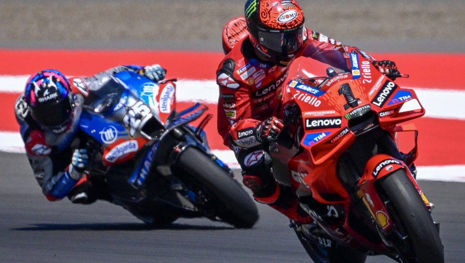 CryptoDATA RNF MotoGP Team's Spanish rider Raul Fernandez (L) and Ducati Lenovo Team's Italian rider Francesco Bagnaia (R) ride during the qualifying of the 2024 MotoGP race at Pertamina Mandalika International Circuit in Mandalika, West Nusa Tenggara on September 28, 2024. (Photo by BAY ISMOYO / AFP)