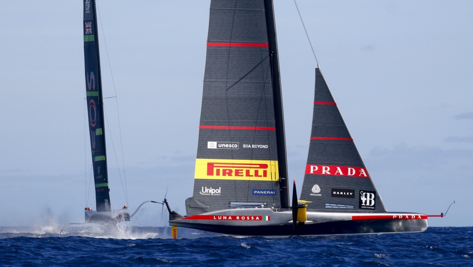 epa11635784 Teams INEOS Britannia (L) and Prada Luna Rossa Pirelli compete during Day 5 in the 2024 Louis Vuitton Cup final in Barcelona, Spain, 01 October 2024. The winner of the Louis Vuitton Cup sailing competition determines the challenger in the 37th America's Cup to be held in October.  EPA/Quique Garcia