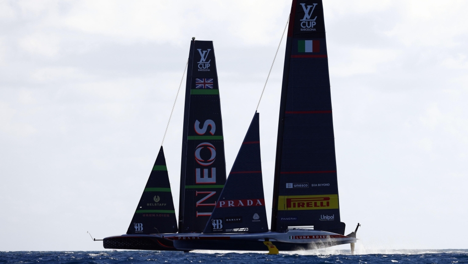 epa11634067 INEOS Britannia (L) and Prada Luna Rossa Pirelli (R) compete during Day 5 of the 2024 Louis Vuitton Cup final in Barcelona, Spain, 30 September 2024. The winner of the Louis Vuitton Cup sailing competition will face defending champion Royal New Zealand Yacht Squadron in the 37th America's Cup to be held in October in Barcelona.  EPA/Quique Garcia