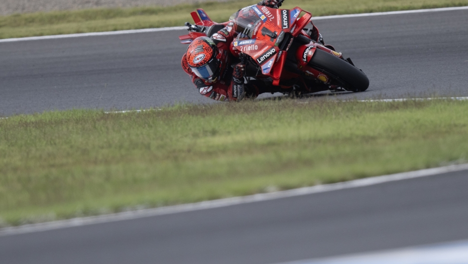 MOTEGI, JAPAN - OCTOBER 04: Francesco Bagnaia of Italy and Ducati Lenovo Team rounds the bend during the MotoGP Of Japan - Free Practice at Twin Ring Motegi on October 04, 2024 in Motegi, Japan. (Photo by Mirco Lazzari gp/Getty Images)