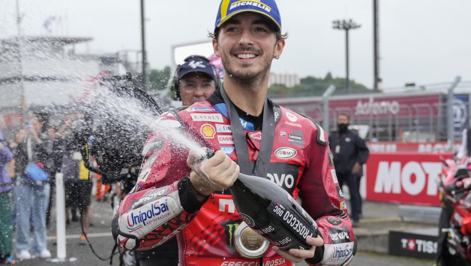 Italian rider Francesco Bagnaia of Ducati Lenovo Team sprays champagne after winning the MotoGP sprint race at the Twin Ring Motegi circuit in Motegi, north of Tokyo, Japan, Saturday, Oct. 5, 2024, ahead of Sunday's MotoGP Japanese Motorcycle Grand Prix. (AP Photo/Hiro Komae)