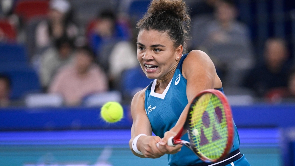 Italy's Jasmine Paolini hits a return to China's Yuan Yue during women's singles match at the Wuhan Open tennis tournament in Wuhan, China's Hubei province on October 9, 2024. (Photo by WANG Zhao / AFP)