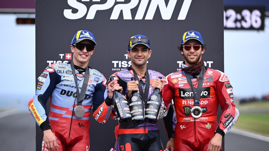 epa11668036 (L-R) Marc Marquez of Spain for Gresini Racing, Jorge Martin of Spain for Prima Pramac Racing and Enea Bastianini of Italy for Ducati Lenovo Team celebrate on the podium after the MotoGP Sprint Race as part of the Australian Motorcycle Grand Prix at the Phillip Island Grand Prix Circuit in Phillip Island, Australia, 19 October 2024.  EPA/JOEL CARRETT  AUSTRALIA AND NEW ZEALAND OUT