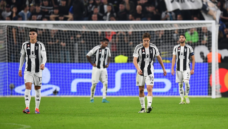 TURIN, ITALY - OCTOBER 22: Vasilije Adzic and Kenan Yildiz of Juventus react after El Bilal Toure of VfB Stuttgart (not pictured) scores his team's first goal during the UEFA Champions League 2024/25 League Phase MD3 match between Juventus and VfB Stuttgart at Juventus Stadium on October 22, 2024 in Turin, Italy. (Photo by Valerio Pennicino/Getty Images)