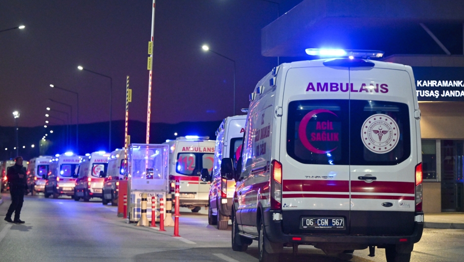 Ambulances wait in line outside of Turkish Aerospace Industries Inc. at the outskirts of Ankara, Turkey, Wednesday, Oct. 23, 2024. (AP Photo/Mert Gokhan Koc)