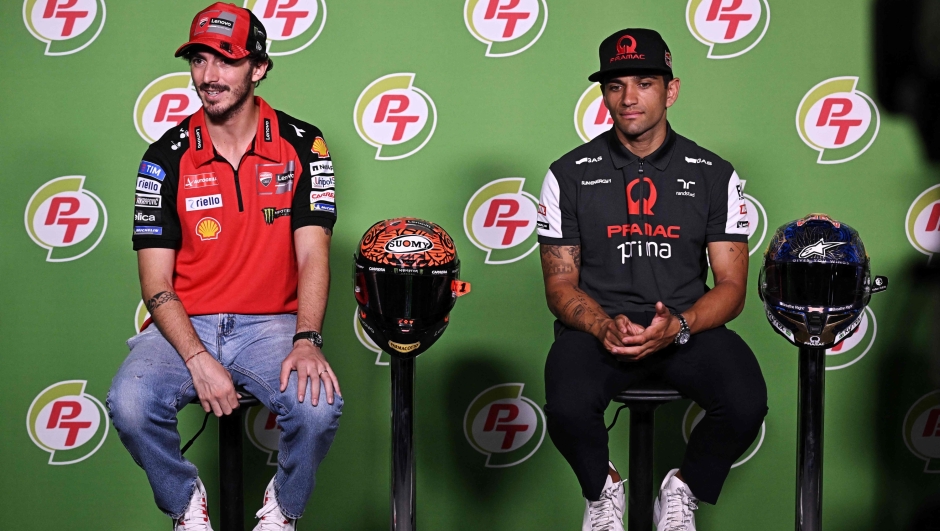 Ducati Lenovo Team's Italian rider Francesco Bagnaia (L) and Prima Pramac Racing's Spanish rider Jorge Martin take part in a press conference ahead of the MotoGP Thailand Grand Prix at the Buriram International Circuit in Buriram on October 24, 2024. (Photo by Lillian SUWANRUMPHA / AFP)