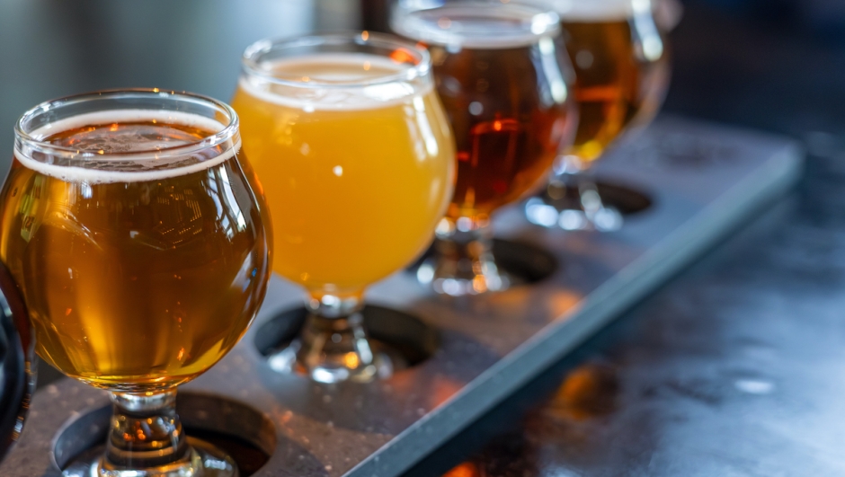 Craft beers served together in a sampler tray for the beer enthusiast in a brewery in Colorado. Selective focus.