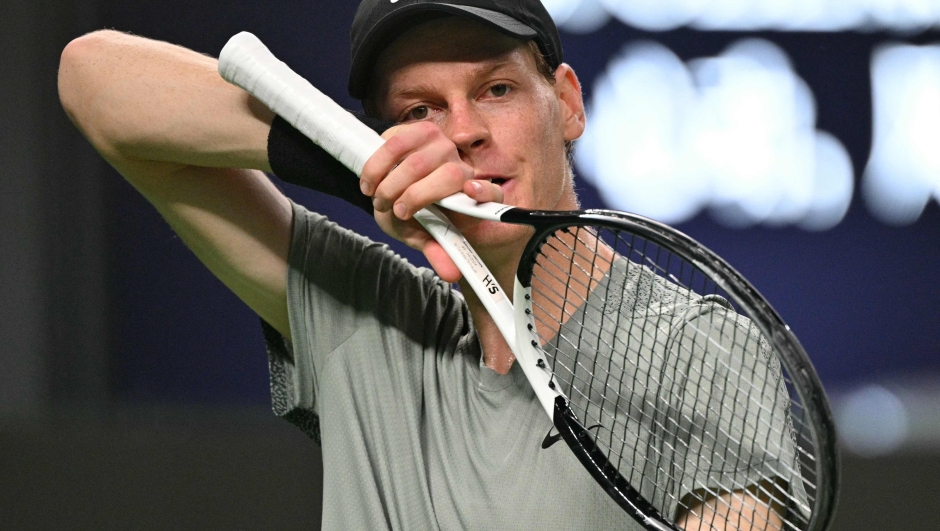 Italy's Jannik Sinner reacts while playing against Serbias Novak Djokovic during their men's singles final match at the Shanghai Masters tennis tournament in Shanghai on October 13, 2024. (Photo by HECTOR RETAMAL / AFP)