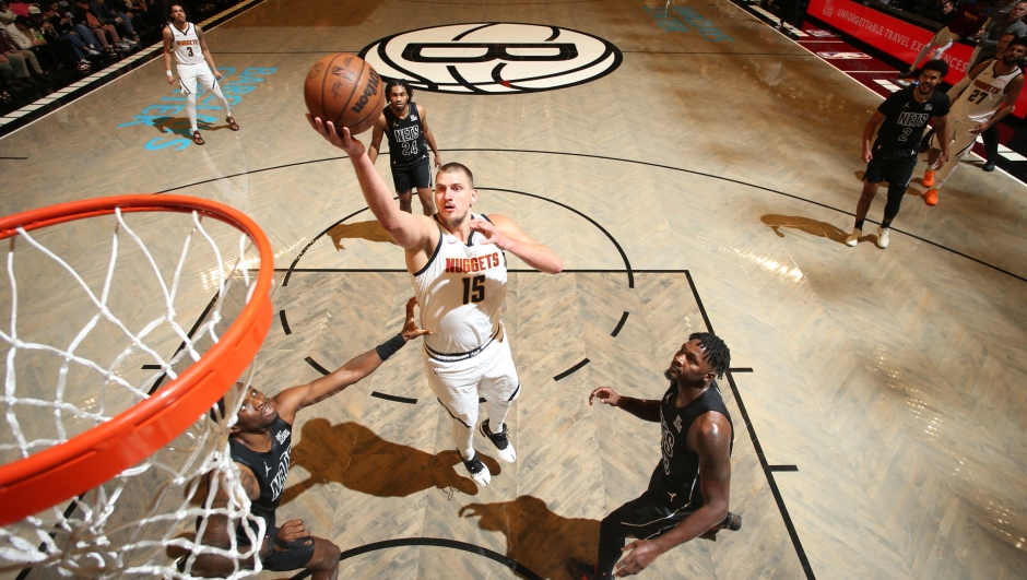 BROOKLYN, NY - OCTOBER 29: Nikola Jokic #15 of the Denver Nuggets drives to the basket during the game against the Brooklyn Nets on October 29, 2024 at Barclays Center in Brooklyn, New York. NOTE TO USER: User expressly acknowledges and agrees that, by downloading and or using this Photograph, user is consenting to the terms and conditions of the Getty Images License Agreement. Mandatory Copyright Notice: Copyright 2024 NBAE   Nathaniel S. Butler/NBAE via Getty Images/AFP (Photo by Nathaniel S. Butler / NBAE / Getty Images / Getty Images via AFP)