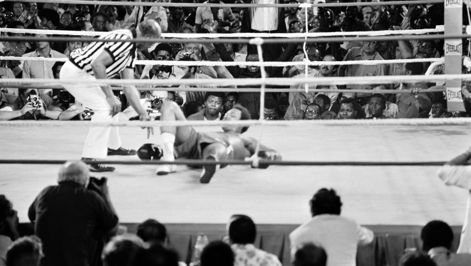 In this photo taken on October 30, 1974 shows the fight between US boxing heavyweight champions, Muhammad Ali (not on the picture) (born Cassius Clay) and George Foreman in Kinshasa. On October 30, 1974 Muhammad Ali knocked out George Foreman in a clash of titans known as the "Rumble in the Jungle", watched by 60 000 people in the stadium in Kinshasa and millions elsewhere. (Photo by AFP)