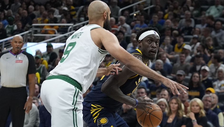 Indiana Pacers' Pascal Siakam goes to the basket against Boston Celtics' Derrick White (9) during the second half of an NBA basketball game, Wednesday, Oct. 30, 2024, in Indianapolis. (AP Photo/Darron Cummings)