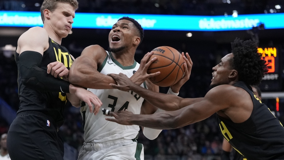 Utah Jazz's Collin Sexton fouls Milwaukee Bucks' Giannis Antetokounmpo during the first half of an NBA basketball game Thursday, Nov. 7, 2024, in Milwaukee. (AP Photo/Morry Gash)