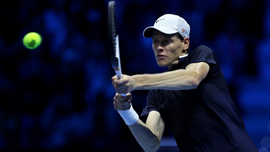 TURIN, ITALY - NOVEMBER 12: Jannik Sinner of Italy plays a backhand against Taylor Fritz of United States in the Men's Singles Ilie Nastase Group Stage match during day three of the Nitto ATP finals 2024 at Inalpi Arena on November 12, 2024 in Turin, Italy. (Photo by Clive Brunskill/Getty Images)