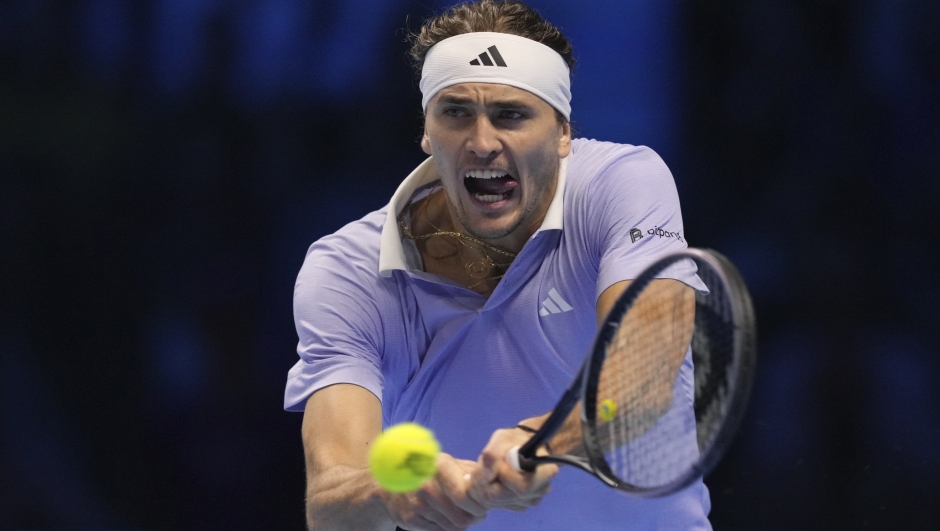 Germany's Alexander Zverev returns the ball to Spain's Carlos Alcaraz during their singles tennis match of the ATP World Tour Finals at the Inalpi Arena, in Turin, Italy, Friday, Nov. 15, 2024. (AP Photo/Antonio Calanni)