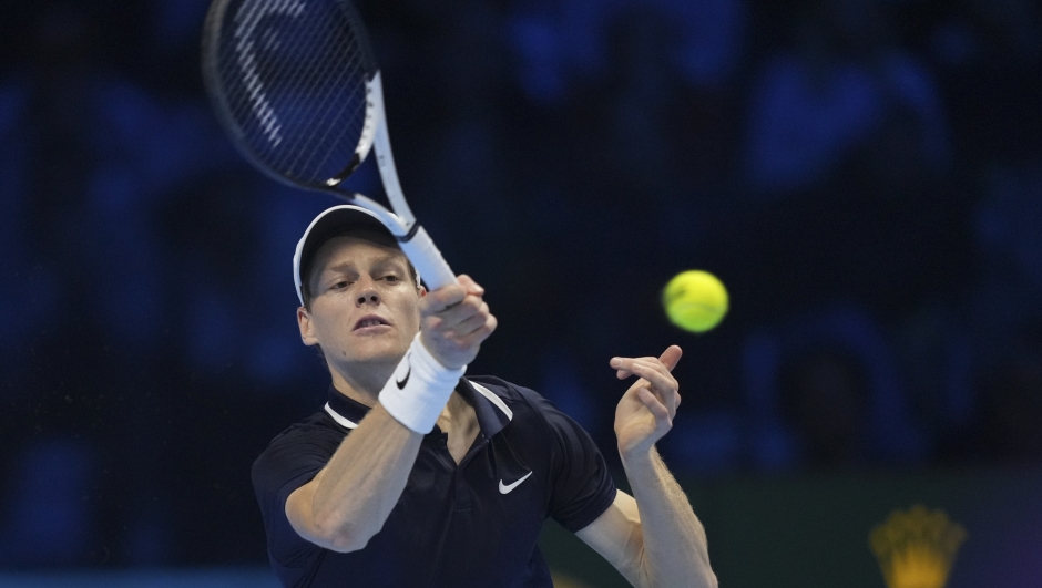 Italy's Jannik Sinner returns to Norway's Casper Ruud during their semifinal tennis match of the ATP World Tour Finals at the Inalpi Arena in Turin, Italy, Saturday, Nov. 16, 2024. (AP Photo/Antonio Calanni)