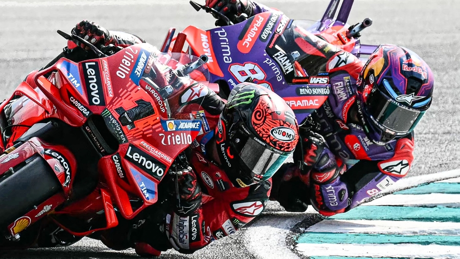 Ducati Lenovo Team's Italian rider Francesco Bagnaia (L) and Prima Pramac Racing's Spanish rider Jorge Martin compete during the MotoGP Malaysian Grand Prix at the Sepang International Circuit in Sepang on November 3, 2024. (Photo by MOHD RASFAN / AFP)