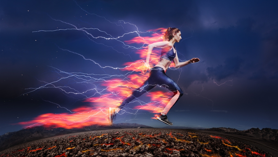 Side view of sporty woman running fast against stormy sky with lightning and tongues of flame