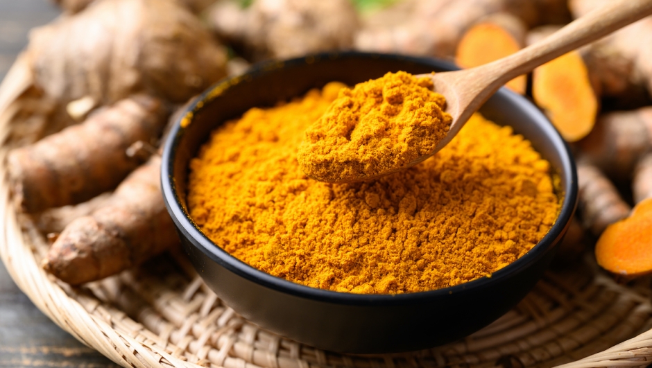 Turmeric powder and fresh turmeric (Curcuma, curcumin), Organic ingredient in Asian cuisine, food coloring or natural dyeing