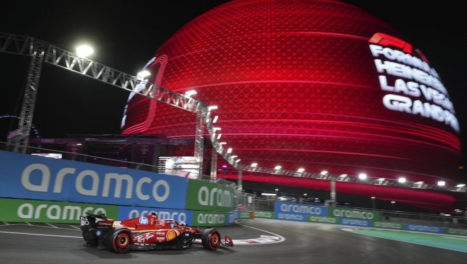 Ferrari driver Carlos Sainz, of Spain, drives during qualifications for the Formula One U.S. Grand Prix auto race, Friday, Nov. 22, 2024, in Las Vegas. (AP Photo/Rick Scuteri)