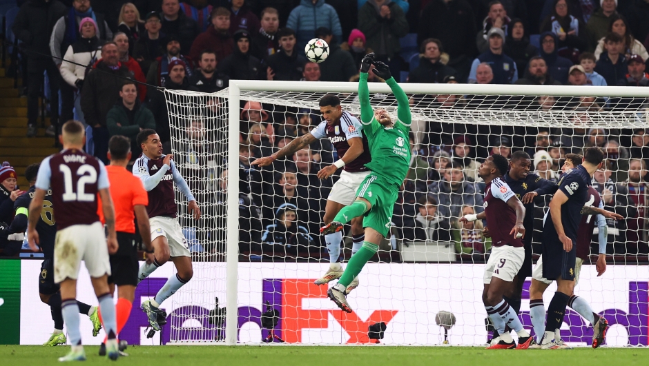 BIRMINGHAM, ENGLAND - NOVEMBER 27: Diego Carlos of Aston Villa fouls Michele Di Gregorio of Juventus, before Morgan Rogers of Aston Villa goes on to score a goal which is later ruled out following a VAR Review, during the UEFA Champions League 2024/25 League Phase MD5 match between Aston Villa FC and Juventus at Villa Park on November 27, 2024 in Birmingham, England. (Photo by Ryan Pierse/Getty Images)avl