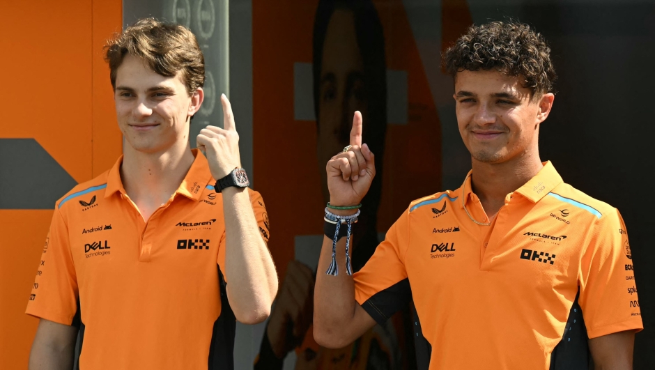 TOPSHOT - McLaren's Australian driver Oscar Piastri (L) and McLaren's British driver Lando Norris pose ahead of the Formula One Azerbaijan Grand Prix in Baku on September 12, 2024. (Photo by Natalia KOLESNIKOVA / AFP)