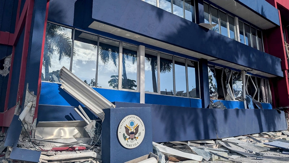 TOPSHOT - This photo shows a general view of a severely damaged building housing the embassies of the United States, United Kingdom, and New Zealand after a powerful earthquake struck Port Vila, the capital city of Vanuatu, on December 17, 2024. A powerful earthquake hit the Pacific island of Vanuatu on December 17, smashing buildings in the capital Port Vila including one housing the US and other embassies, with a witness telling AFP of bodies seen in the city. (Photo by AFP)