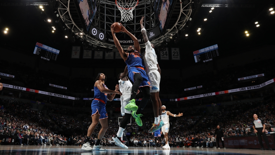 MINNEAPOLIS, MN - DECEMBER 19: Karl-Anthony Towns #32 of the New York Knicks shoots the ball during the game against the Minnesota Timberwolves on December 19, 2024 at Target Center in Minneapolis, Minnesota. NOTE TO USER: User expressly acknowledges and agrees that, by downloading and or using this Photograph, user is consenting to the terms and conditions of the Getty Images License Agreement. Mandatory Copyright Notice: Copyright 2024 NBAE   Jordan Johnson/NBAE via Getty Images/AFP (Photo by Jordan Johnson / NBAE / Getty Images / Getty Images via AFP)