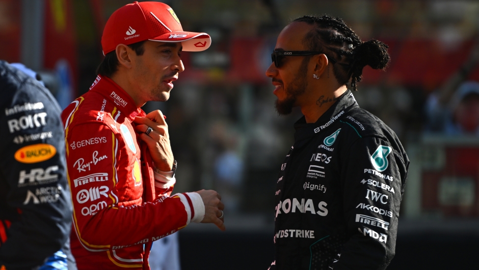 ABU DHABI, UNITED ARAB EMIRATES - DECEMBER 08: Charles Leclerc of Monaco and Ferrari and Lewis Hamilton of Great Britain and Mercedes talk prior to the F1 Grand Prix of Abu Dhabi at Yas Marina Circuit on December 08, 2024 in Abu Dhabi, United Arab Emirates. (Photo by Rudy Carezzevoli/Getty Images)