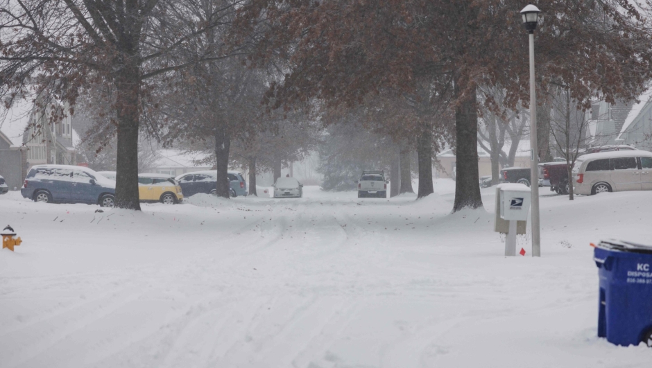 SHAWNEE, KANSAS - JANUARY 5: Tire tracks scatter across the snow covered road in a neighborhood on January 5, 2025 in Shawnee, Kansas. A large swath of the U.S., across the Midwest to the East Coast is experiencing a major Winter storm, with more than two feet of snow in some areas. A state of emergency has been declared in Kentucky and Virginia.   Chase Castor/Getty Images/AFP (Photo by Chase Castor / GETTY IMAGES NORTH AMERICA / Getty Images via AFP)