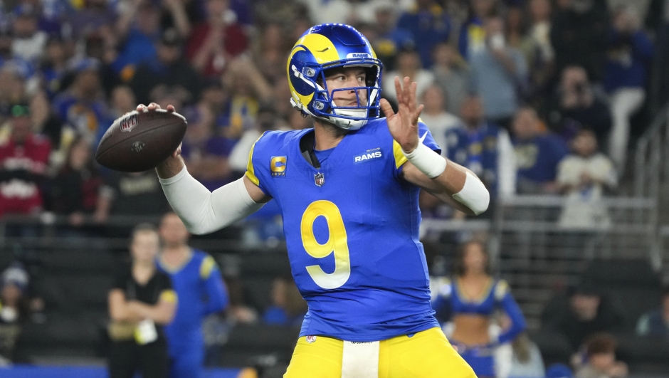 Los Angeles Rams quarterback Matthew Stafford (9) throws against the Minnesota Vikings during the first half of an NFL wild card playoff football game, Monday, Jan. 13, 2025, in Glendale, Ariz. (AP Photo/Rick Scuteri)