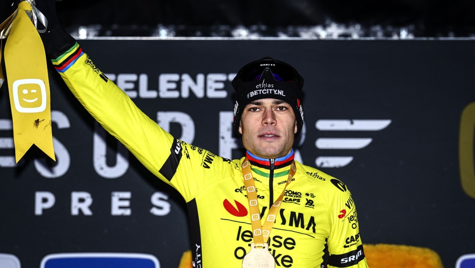 Belgium's Wout van Aert celebrates on the podium afer winning the men's elite Superprestige cyclocross cycling race, in Gullegem on January 4, 2025. (Photo by DAVID PINTENS / Belga / AFP) / Belgium OUT