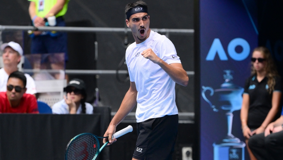 Italy's Lorenzo Sonego reacts on a point against USA's Learner Tien during their men's singles match on day nine of the Australian Open tennis tournament in Melbourne on January 20, 2025. (Photo by Yuichi YAMAZAKI / AFP) / -- IMAGE RESTRICTED TO EDITORIAL USE - STRICTLY NO COMMERCIAL USE --