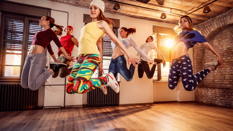 Group of young dancer people jumping during music