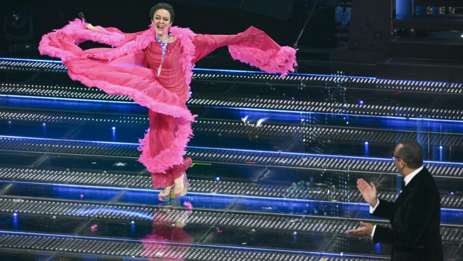 Italian actor Brenda Lodigiani (L) and Sanremo Festival host and artistic director Carlo Conti on stage at the Ariston theatre during the 75th edition of the Sanremo Italian Song Festival, in Sanremo, Italy, 15 February 2025. The music festival will run from 11 to 15 February 2025.  ANSA/ETTORE FERRARI