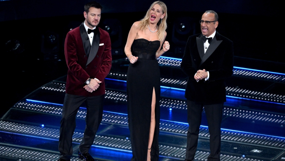 (L-R) Italian Tv presenters Alessandro Cattelan and Alessia Marcuzzi with Sanremo Festival host and artistic director Carlo Conti on stage at the Ariston theatre during the 75th edition of the Sanremo Italian Song Festival, in Sanremo, Italy, 15 February 2025. The music festival will run from 11 to 15 February 2025.  ANSA/ETTORE FERRARI