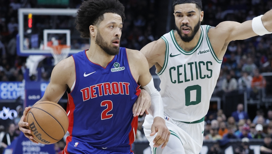 Detroit Pistons guard Cade Cunningham (2) drives to the basket against Boston Celtics forward Jayson Tatum (0) during the second half of an NBA basketball game Wednesday, Feb. 26, 2025, in Detroit. (AP Photo/Duane Burleson)