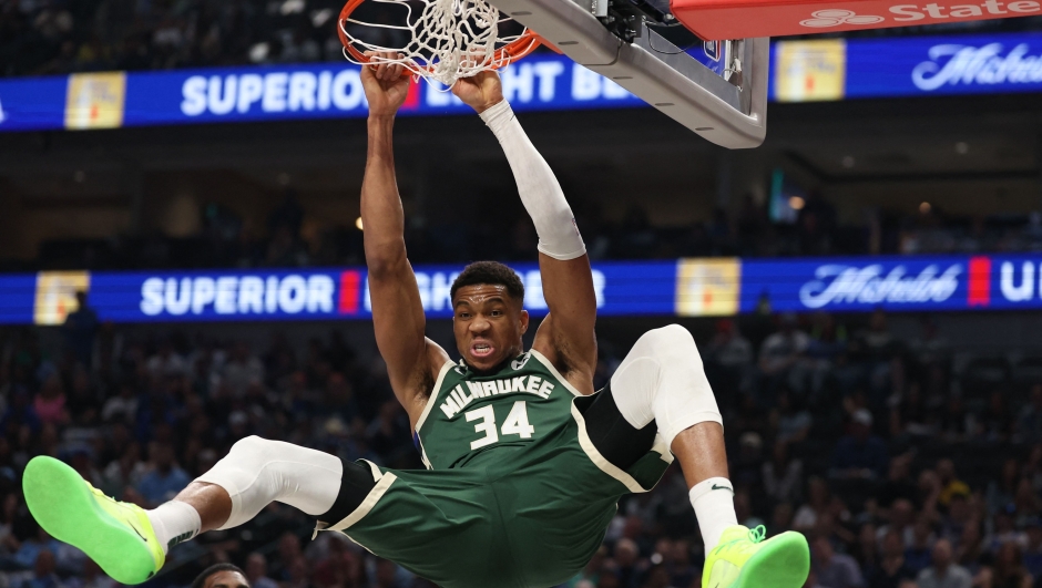 DALLAS, TEXAS - MARCH 01: Giannis Antetokounmpo #34 of the Milwaukee Bucks hangs on the rim after dunking during the first half against the Dallas Mavericks at American Airlines Center on March 01, 2025 in Dallas, Texas. NOTE TO USER: User expressly acknowledges and agrees that, by downloading and/or using this photograph, user is consenting to the terms and conditions of the Getty Images License Agreement.   Sam Hodde/Getty Images/AFP (Photo by Sam Hodde / GETTY IMAGES NORTH AMERICA / Getty Images via AFP)