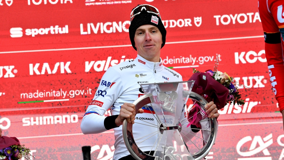 POGACAR Tadej (UAE TEAM EMIRATES) celebrates his victory on the podium after winning the men's elite race of the 'Strade Bianche' (White Roads)one day cycling race (215km) from and to Siena - Tuscany,- Saturday, MARCH 2, 2024. Sport - cycling . (Photo by Gian MAttia D'Alberto/LaPresse)