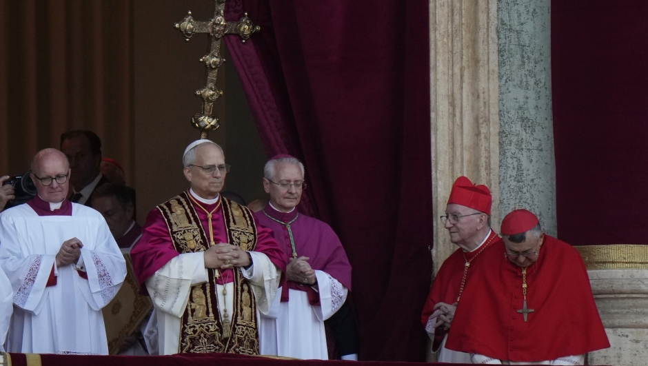 Pope Leo XIV, center left, appears on the balcony of St Peter's Basilica after his election, at the Vatican, Thursday, May 8, 2025. (AP Photo/Luca Bruno)