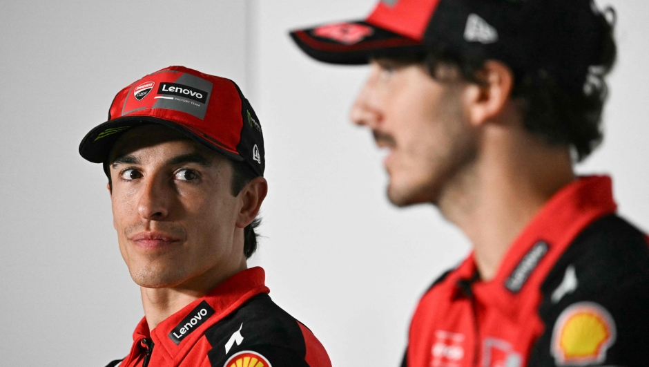 Team Ducati Lenovo Team's Marc Marquez (L) listens to Team Ducati Lenovo Team's Francesco Bagnaia during a press conference ahead of the MotoGP Spanish Grand Prix at the Jerez racetrack in Jerez de la Frontera on April 24, 2025. (Photo by JAVIER SORIANO / AFP)
