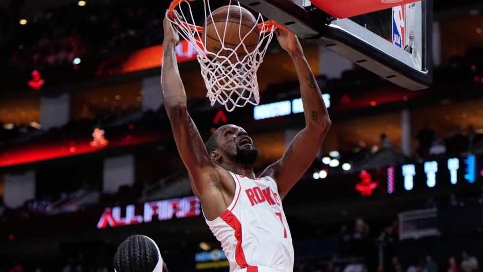 Houston Rockets forward Kevin Durant dunks during the first half of an NBA basketball preseason game against the Utah Jazz in Houston, Wednesday, Oct. 8, 2025. (AP Photo/Ashley Landis)