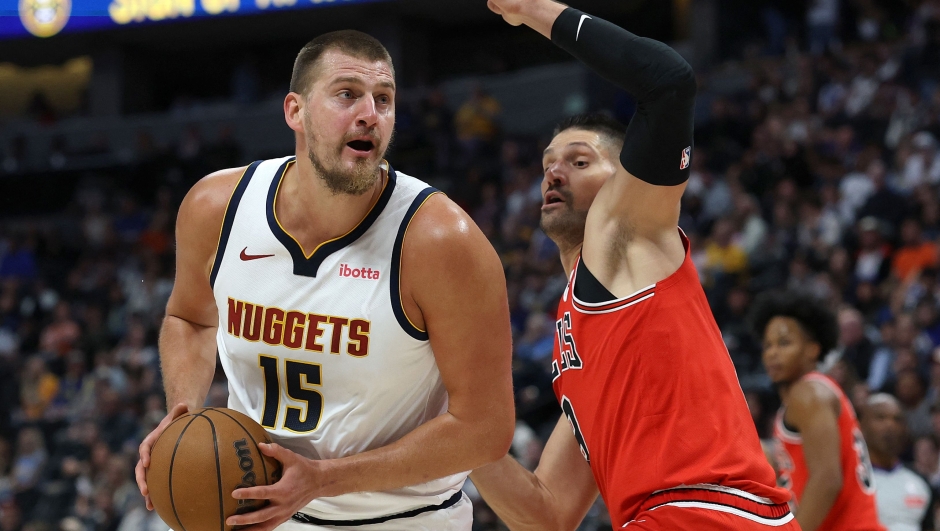 Nikola Jokic #15 of the Denver Nuggets drives against Nikola Vucevic #9 of the Chicago Bulls in the first quarter at Ball Arena on October 14, 2025 in Denver, Colorado. NOTE TO USER: User expressly acknowledges and agrees that, by downloading and or using this photograph, User is consenting to the terms and conditions of the Getty Images License Agreement. Matthew Stockman/Getty Images/AFP (Photo by MATTHEW STOCKMAN / GETTY IMAGES NORTH AMERICA / Getty Images via AFP)
