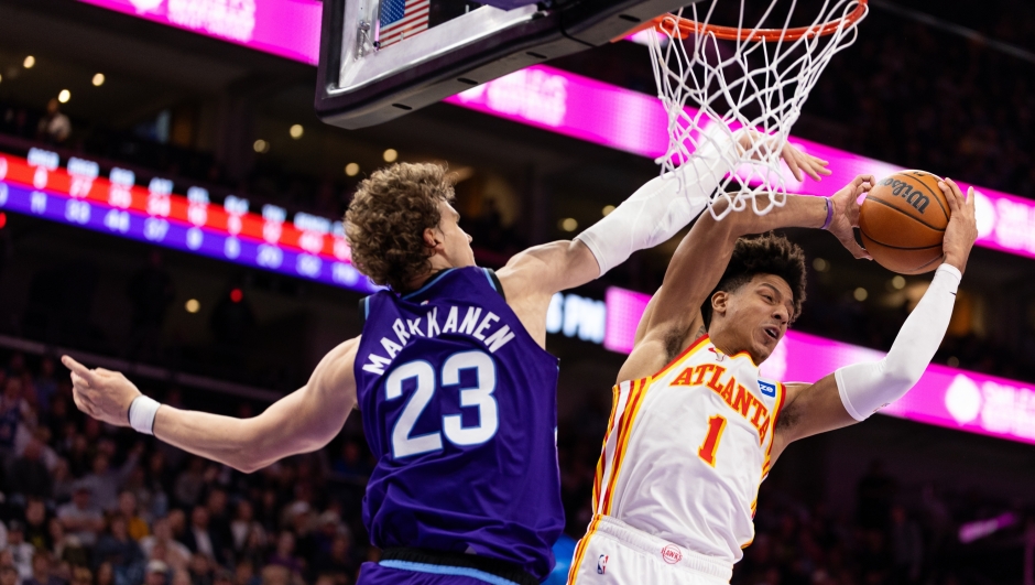 Atlanta Hawks forward Jalen Johnson (1) gets a rebound over Utah Jazz forward Lauri Markkanen (23) during the second half of an NBA basketball game, Thursday, Nov. 13, 2025, in Salt Lake City. (AP Photo/Anna Fuder)
