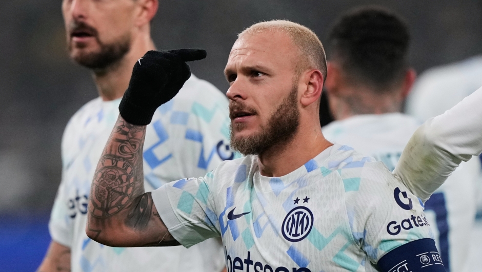 Inter Milan's Federico Dimarco celebrates after he scored the opening goal during the Champions League opening phase soccer match between Borussia Dortmund and Inter Milan in Dortmund, Germany, Wednesday, Jan. 28, 2026. (AP Photo/Martin Meissner)