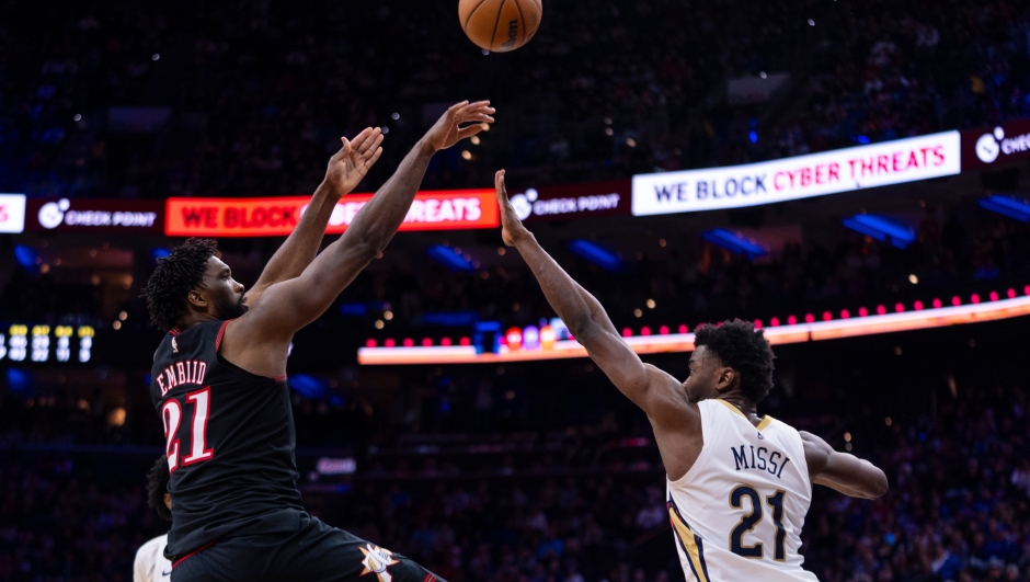 Philadelphia 76ers' Joel Embiid, left, shoots the ball over New Orleans Pelicans' Yves Missi, right, during the second half of an NBA basketball game, Saturday, Jan. 31, 2026, in Philadelphia. (AP Photo/Chris Szagola)