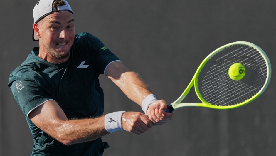 Jan-Lennard Struff of Germany plays a backhand return to Vit Kopriva of the Czech Republic during their first round match at the Australian Open tennis championship in Melbourne, Australia, Tuesday, Jan. 20, 2026. (AP Photo/Dar Yasin)      Associate Press/ LaPresse Only Italy and Spain