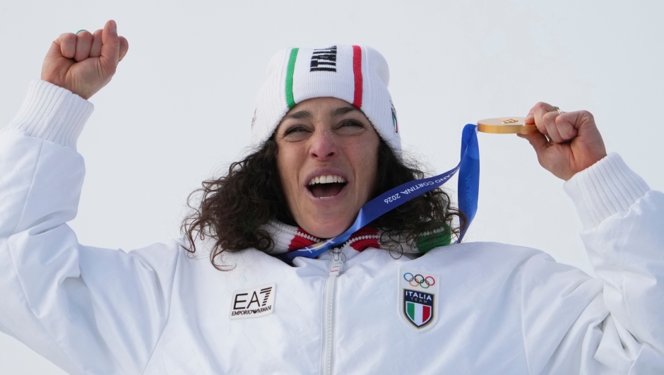 Italy's Federica Brignone celebrates winning the gold medal in an alpine ski, women's super-G race, at the 2026 Winter Olympics, in Cortina d'Ampezzo, Italy, Thursday, Feb. 12, 2026. (AP Photo/Jacquelyn Martin)      Associate Press/ LaPresse Only Italy and Spain