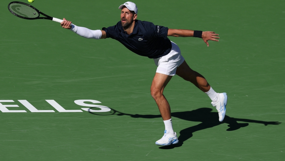  Novak Djokovic of Serbia plays a forehand against Kamil Majchrzak of Poland in their second round match of the BNP Paribas Open at Indian Wells Tennis Garden on March 07, 2026 in Indian Wells, California.   Clive Brunskill/Getty Images/AFP (Photo by CLIVE BRUNSKILL / GETTY IMAGES NORTH AMERICA / Getty Images via AFP)