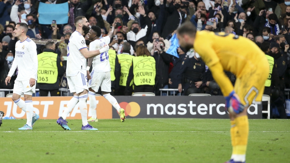 Karim Benzema of Real Madrid celebrates his goal while goalkeeper of PSG Gianluigi Donnarumma looks down during the UEFA Champions League, Round of 16, 2nd leg football match between Real Madrid and Paris Saint-Germain (PSG) on March 9, 2022 at Santiago Bernabeu stadium in Madrid, Spain - Photo Jean Catuffe / DPPI (Photo by Jean Catuffe / DPPI via AFP)